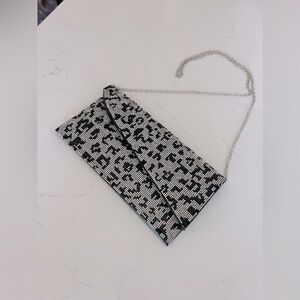 Beautiful Bella Collection animal print clutch with shoulder strap